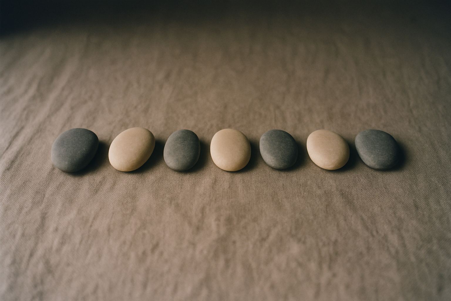 Pebbles graded by size, the differences obvious only when laid in a row.